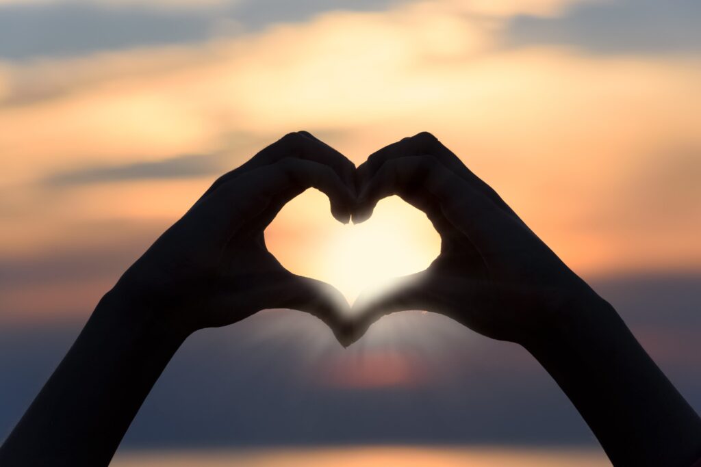 Two hands forming a heart shape, symbolizing couples counselling and connection.